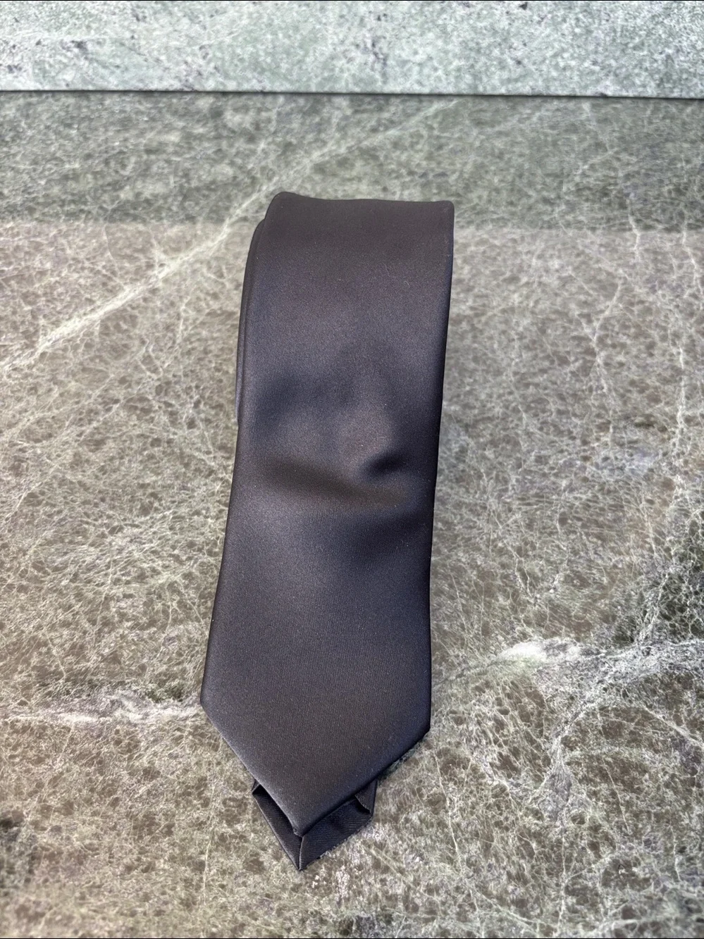 Structure Neckwear solid black tie features a classic, smooth satin finish.